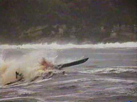 Mick Verrier powering out through storm waves at South Cape Rivulet